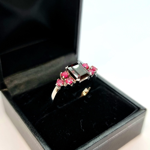 17 - A garnet and ruby stone set sterling silver ring. Ring size Q, weight 4.1g. New from the gem company... 