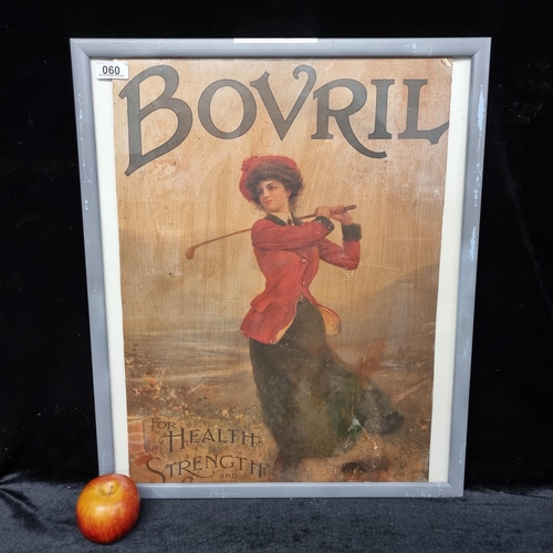 60 - Antique 1920's advertisement for Bovril spread, showing a young woman playing golf and reading 