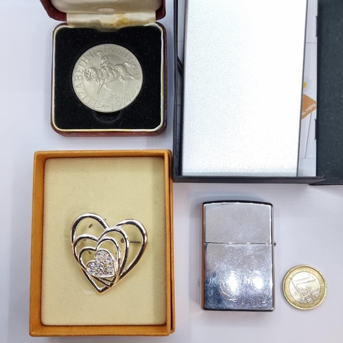 9 - Four items, consisting of a 1977 Elizabeth II commemorative coin in presentation box. Together with ... 