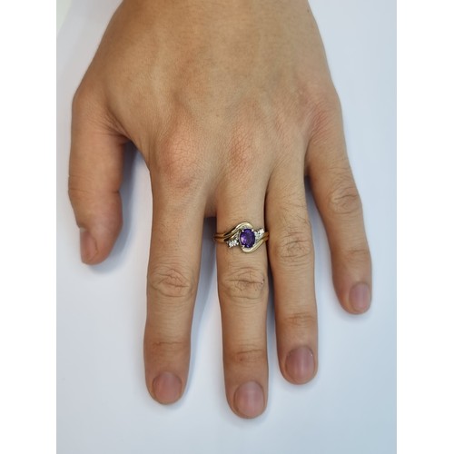 2 - A nice example of a 9K gold amethyst and diamond ring. Ring size O, weight 2.6g.