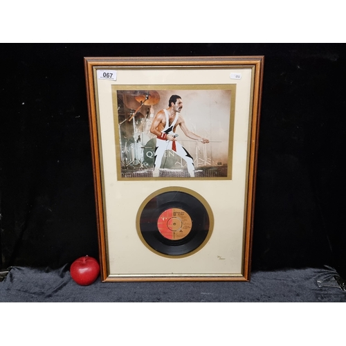 A framed limited edition (39/1000) Queen collectors pieces including a vinyl record of "Seven Seas of Rhye" from the album Queen II with a photograph of Freddy Mercury performing at the "Works!" tour Australia 1984.  All housed in a wood and gilt frame and with certificate of authenticity on the reverse.
