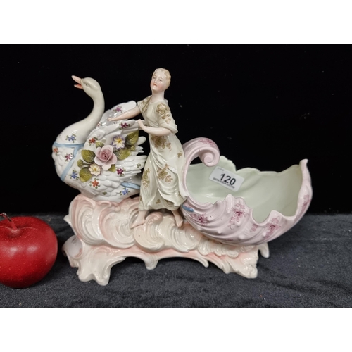 120 - A highly ornate antique porcelain sculptural piece depicting an elegant lady riding a swan carriage,... 