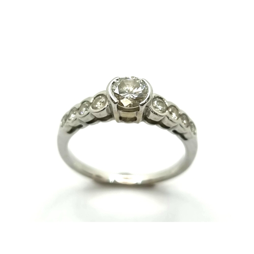 407 - Star Lot : A very attractive 18k white gold diamond ring. Weight of centre diamond 0.65cts. Ring siz... 