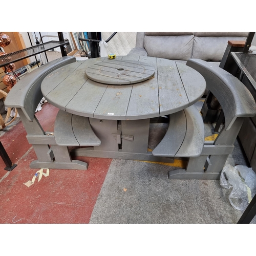 516 - Star Lot : A great quality, heavy wooden garden table  made from sycamore in a cool circular shape w... 