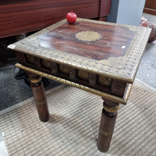 553 - A interesting square side table profusely decorated with brass applique border and detail with flora... 