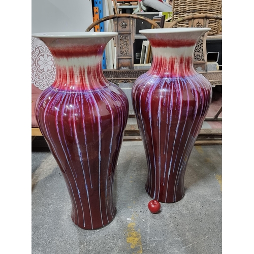 643 - Star Lot : Two Huge  decorative vases with a stunning deep red and lilac drip glaze. Over a meter ta... 