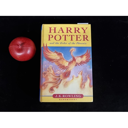 A hardback first edition copy of the book: ''Harry Potter and the Order of Phoenix'' by J.K. Rowling. Published in 2003. In good condition.