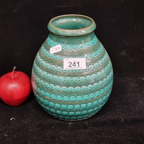 A beautiful vintage art pottery in a lovely shade of green and turquoise with a high gloss finish and textured ornament.