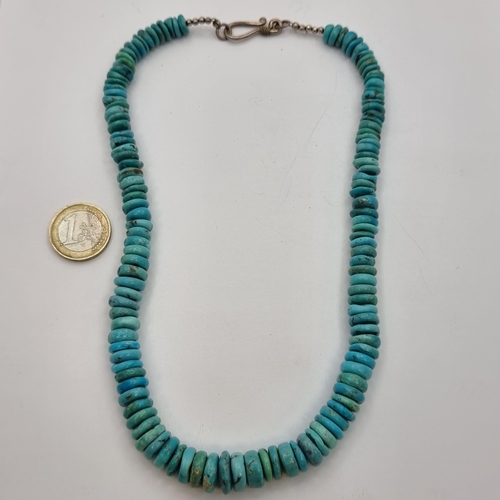 44 - A very heavy graduated Turquoise necklace. Length: 42cm. Cold to the touch.