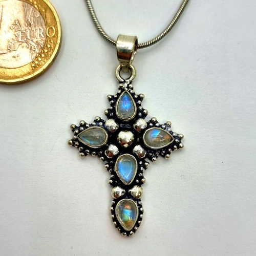 45 - A very pretty example of a sterling silver cross pendant, set with inlayed moonstone setting. Length... 