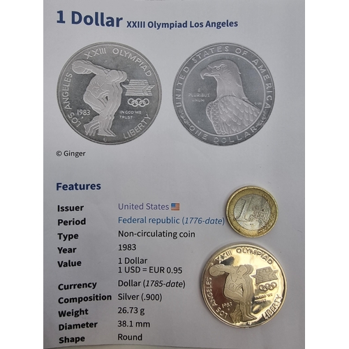 7 - A USA 1 Dollar XX111 Olympiad Los Angles number one uncirculated coin. Weight 26.73 grams and a silv... 