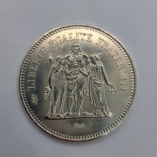 5 - A French 50 franc fifth republic 1958 standard circulation coin. With a weight 30 g and silver conte... 