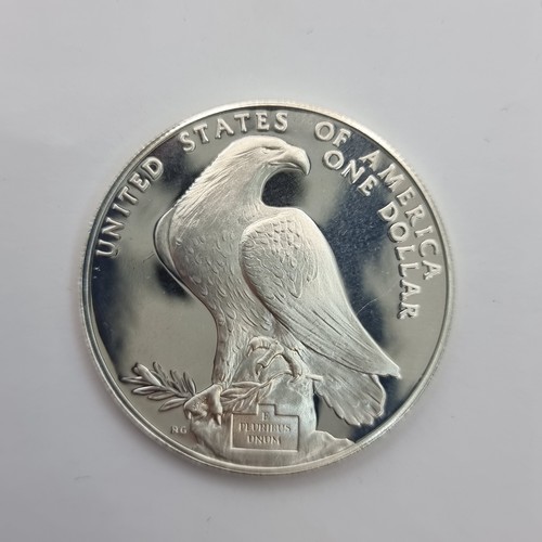 6 - A United States one Dollar Olympics uncirculated coin, year 1984. Weight of coin 26.73 grams and a .... 
