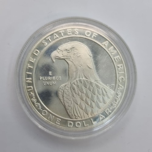 7 - A USA 1 Dollar XX111 Olympiad Los Angles number one uncirculated coin. Weight 26.73 grams and a silv... 