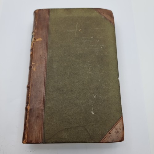 52 - Star Lot: A Antique Moroccan leather and board bound book, entitled 