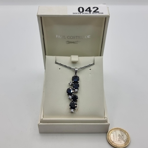 42 - A Paul Costelloe Black onyx pendant with a lovely sterling silver chain. Length of chain: 44cm.