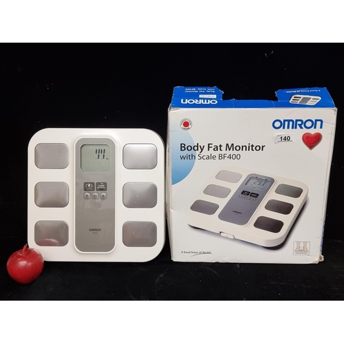 An OMRON brand Body Fat Monitor with Scale. Model BF400. New in original box.