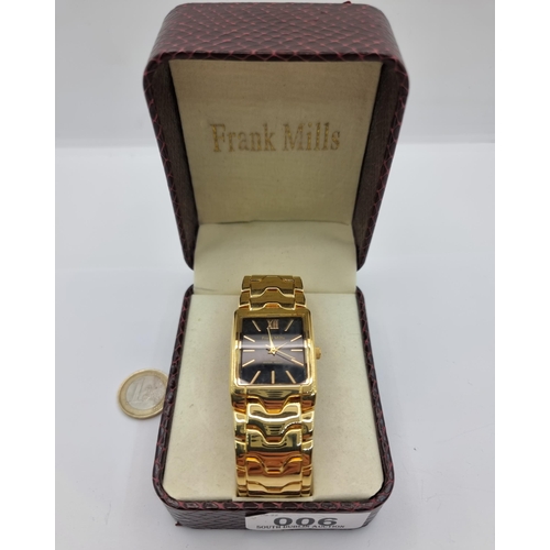 6 - A striking Frank Mills tank style gold toned wrist watch. With black dial, batton hands and sweep se... 