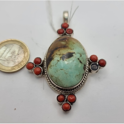9 - A nice vintage Native American heavy sterling silver pendant, set with a lovely large Turquoise ston... 