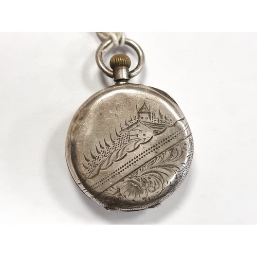 15 - A sterling silver white enameled face pocket watch, with pretty gold toned detailing. To reverse, th... 