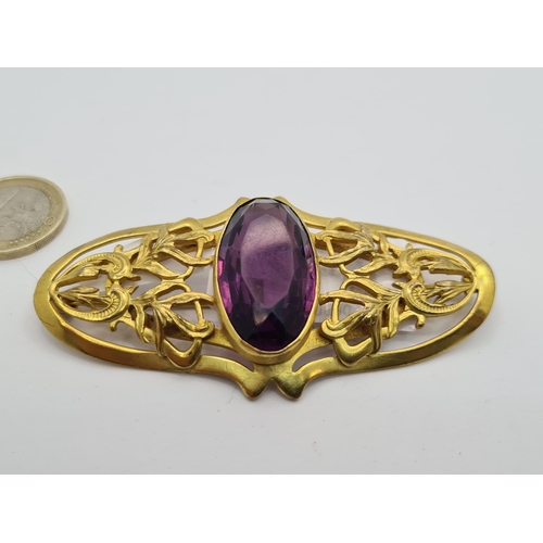 12 - A very beautiful facet cut amethyst Art Nouveau style sash brooch, with foliate design to mount. Pin... 