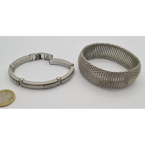 29 - Two jewellery items, including a Fossil inlayed design bracelet and a mesh thick bangle.