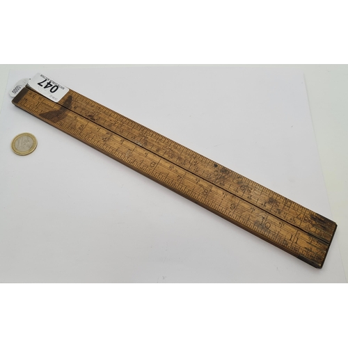 47 - A vintage wood folding four sectional ruler, measuring 48