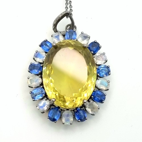 37 - A fantastic pendant necklace with large Citrine (36cts) central stone and a halo of blue kyanite and... 