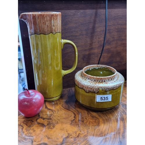 535 - A sunning pair of mid century Arklow studio Pottery pieces including a biscuit jar and a tall jug. B... 