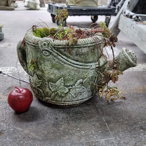 A charming reconstituted stone garden planter in the form of a watering can. H23cm.