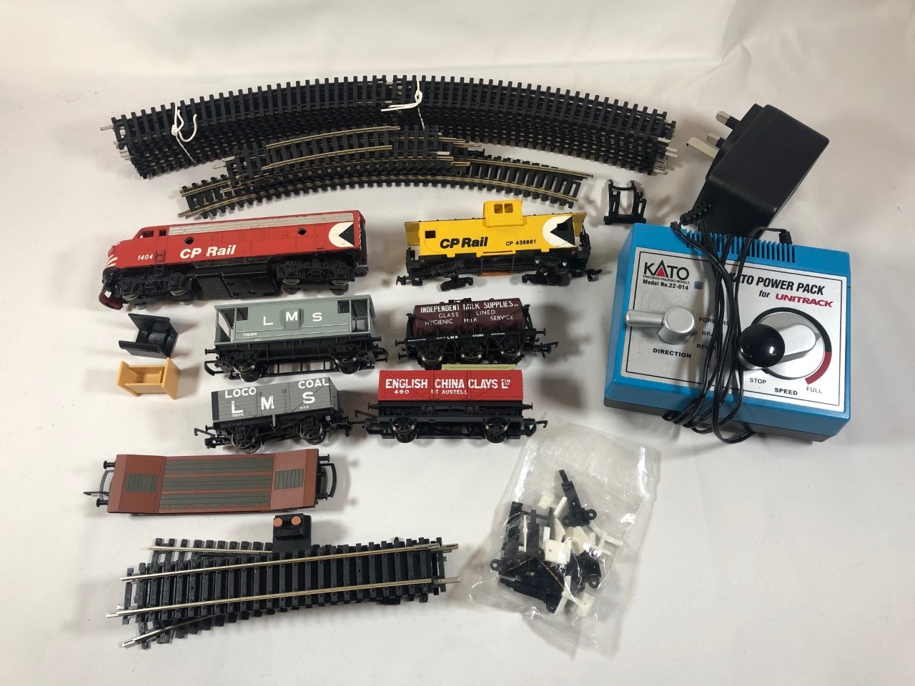 Model trains, power pack and track assortment. 00 Gauge. Includes Kato