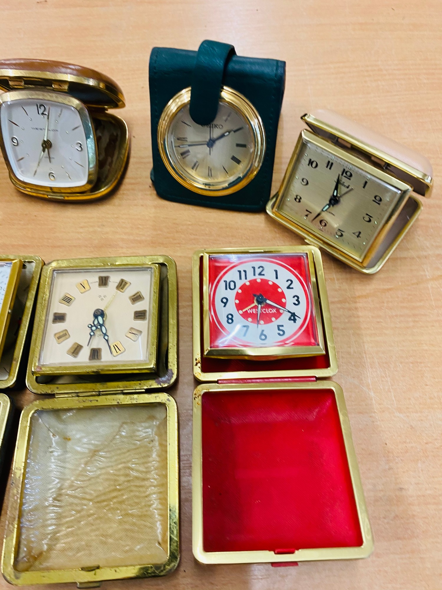 Selection of 12 vintage travel clocks, all untested