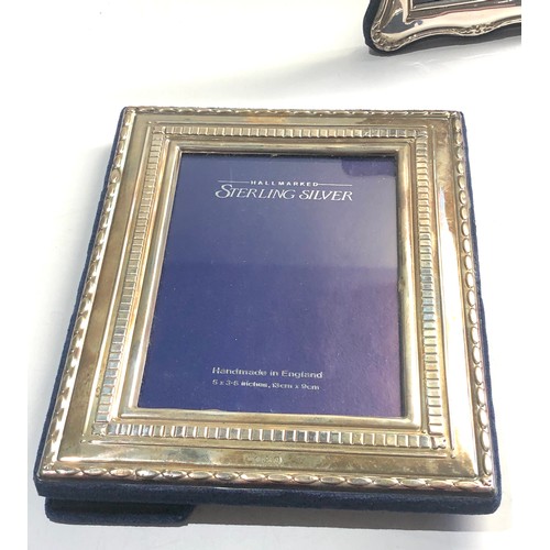 14 - 3 silver hallmarked picture frames largest measures approx 20cm by 15cm