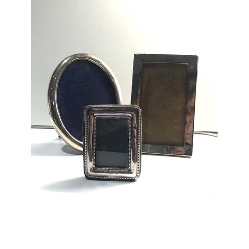 34 - 3 silver hallmarked picture frames largest measures approx 15cm by 11cm