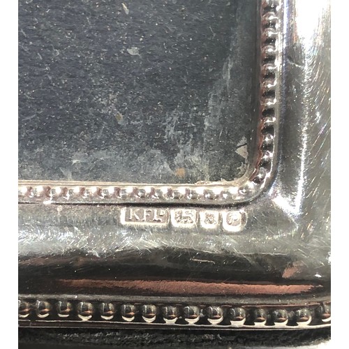 34 - 3 silver hallmarked picture frames largest measures approx 15cm by 11cm