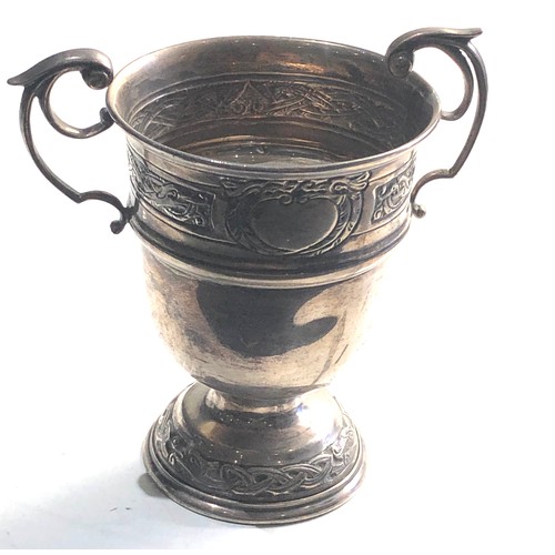 32 - Irish Silver twin handled cup measures approx 12cm tall 8cm dia weight 136g