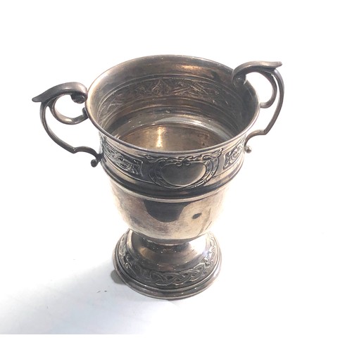 32 - Irish Silver twin handled cup measures approx 12cm tall 8cm dia weight 136g