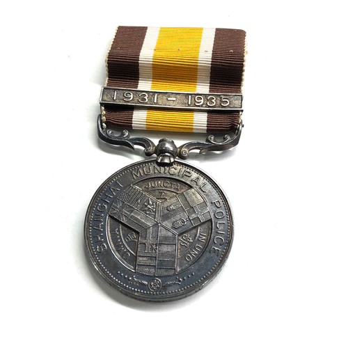 539 - Rare Shanghi municipal police long service medal date bar 1931-1935  to assistant head gaoler j.w ja... 