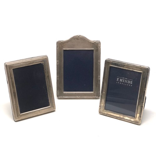 42 - 3 small silver picture frames largest measures approx 13cm by 9cm