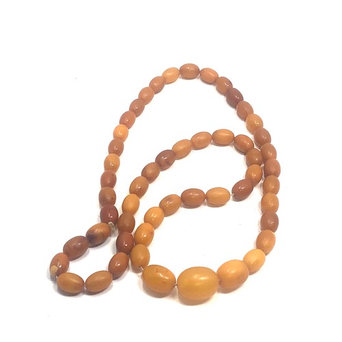 58 - Egg yolk amber bead necklace weight 40g