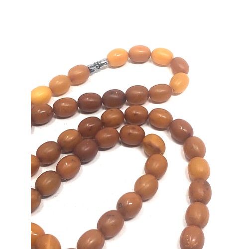 60 - Egg yolk amber bead necklace weight 45g