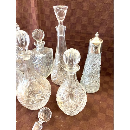 55 - Selection of 6 cut glass decanters with stoppers, silver plated claret jug