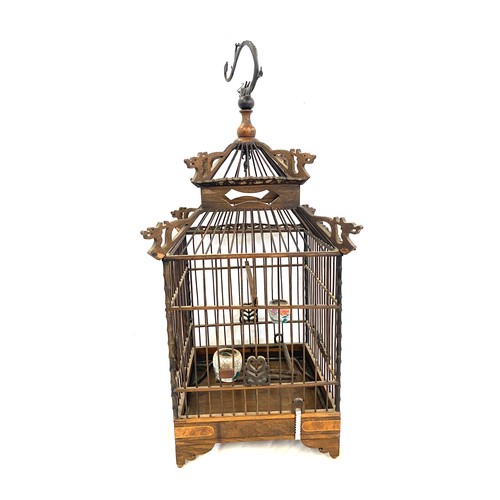 58 - Small oriental dragon themed bird cage measures approx 50cm tall