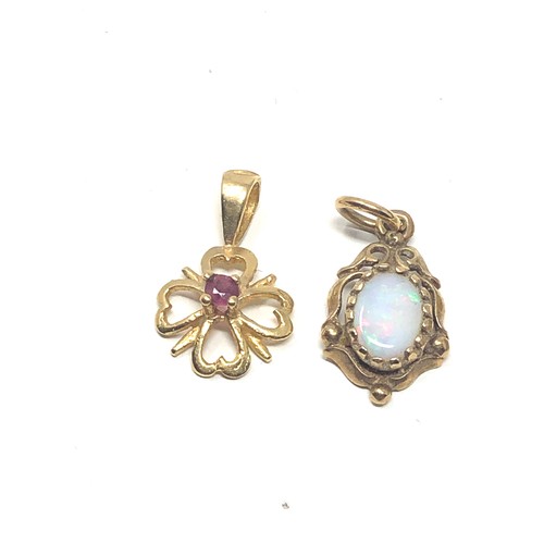 60 - 3 x 9ct gold gemstone pendants inc. tanzanite, ruby & opal (2.2g)