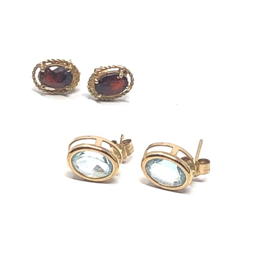 59 - 3 x 9ct gold stud earrings inc. peridot, topaz & garnet (2.7g)