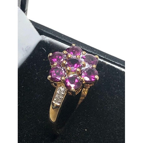 49 - 9ct gold garnet & diamond floral ring (2.1g)