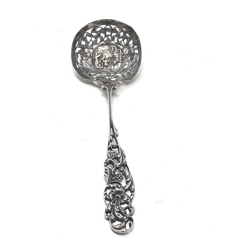 37 - Antique dutch silver shifter spoon central embossed panel measures approx 21cm long