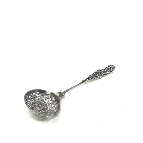 37 - Antique dutch silver shifter spoon central embossed panel measures approx 21cm long