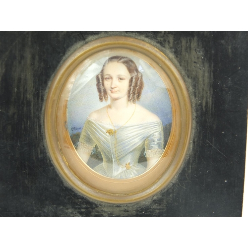 9 - Miniature watercolour of a young girl, G. Soyet , mounted in a black wooden frame, 7.5cm high