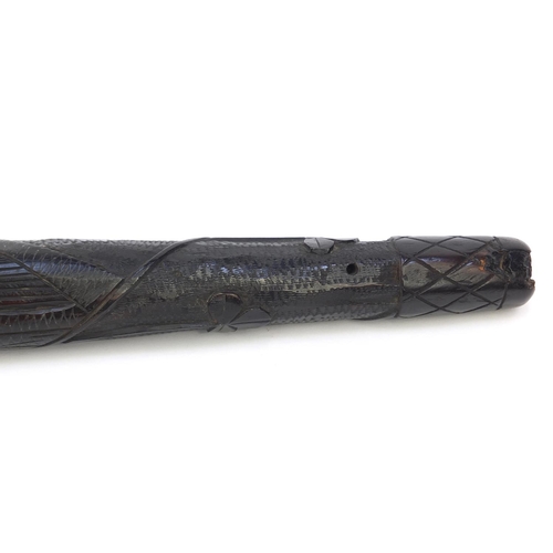 56 - Victorian Irish wooden bog oak truncheon carved with a clover leaf design, 37cm long